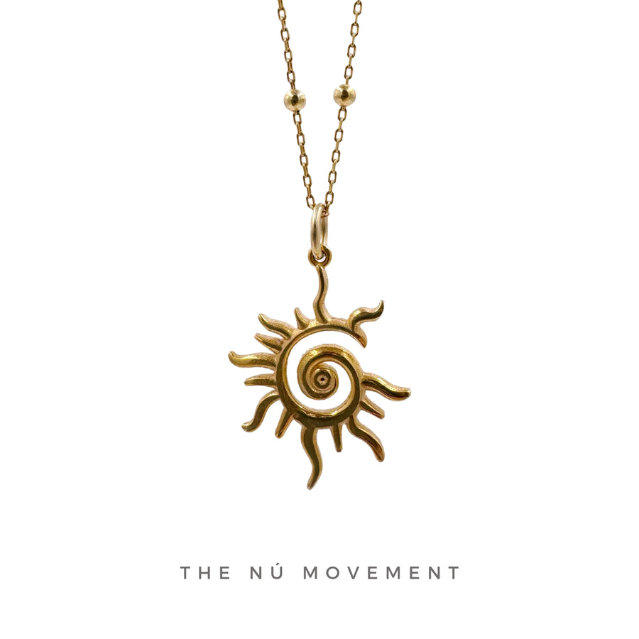 THENÚM Spiral Sun Necklace – gold spiral sun pendant