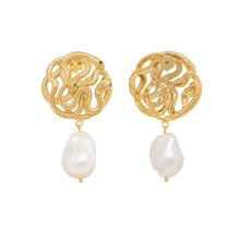 Gold Serpent earrings with intricate designs and pearl drops on a white background