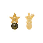 Gold star-shaped earrings with a central gemstone on a white background