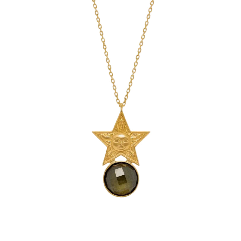Gold star pendant necklace with a dark gemstone on a white background