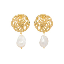 Gold snake earrings with pearl drops on a white background