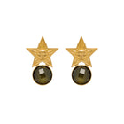 Gold star-shaped earrings with dark gemstones on a white background