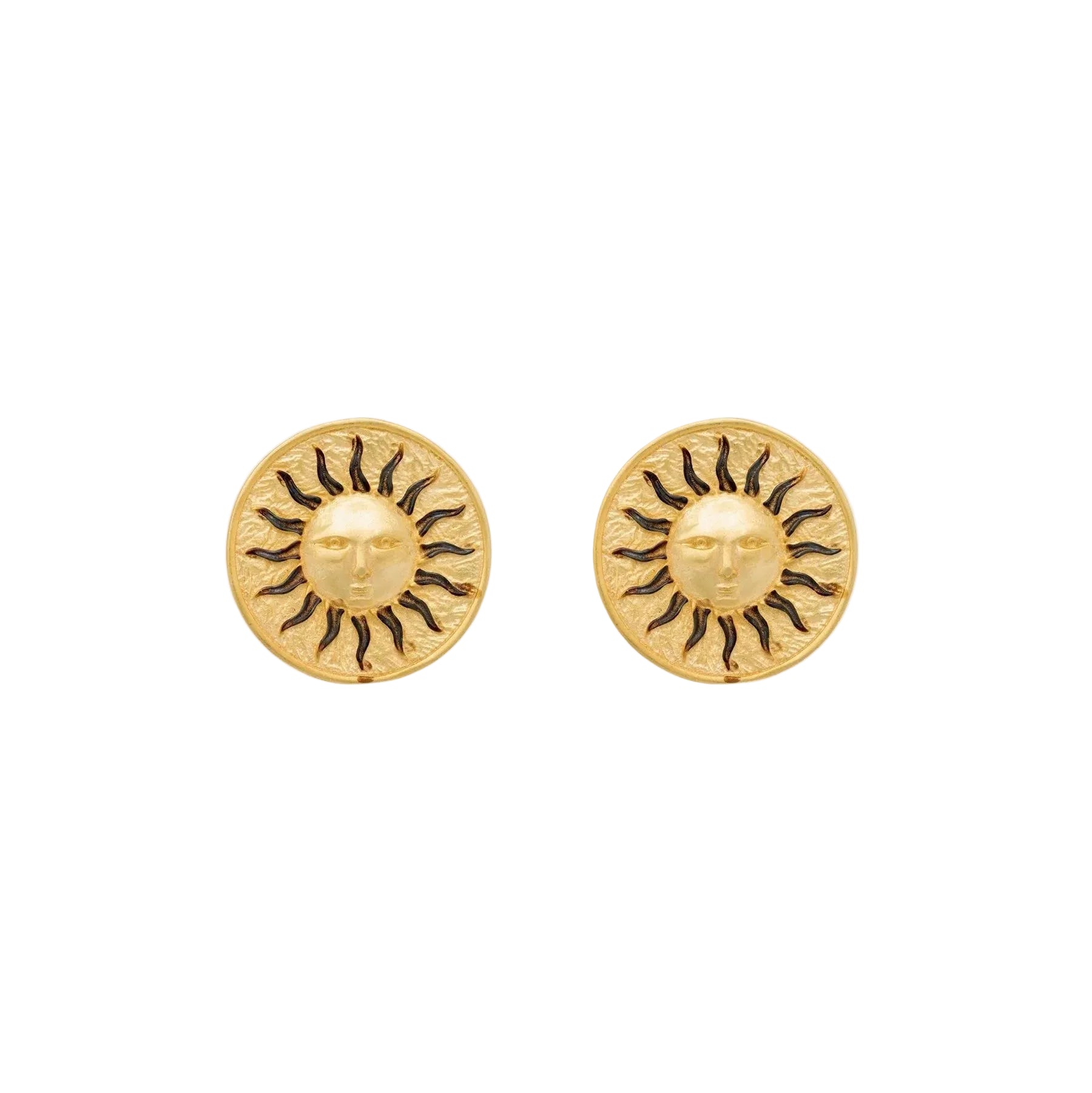 Gold sun stud earrings on ivoy background