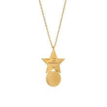 Gold necklace with star-shaped pendant on a white background