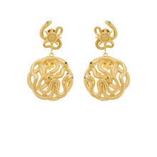 gold story earring with serpent light sun and star