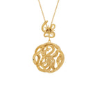 Gold necklace with snake and sun star pendant on a white background