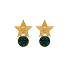 Gold star earrings with green circular centers on a white background
