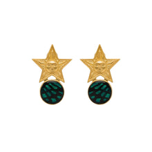 Gold star earrings with green circular centers on a white background