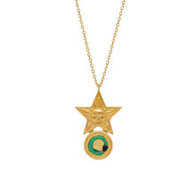 Gold necklace with a star-shaped pendant featuring a snake and sun design on a white background