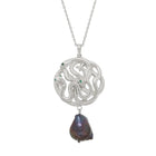 Silver necklace with a serpent pendant and a black pearl on a white background