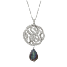 Silver necklace with a serpent pendant and a black pearl on a white background