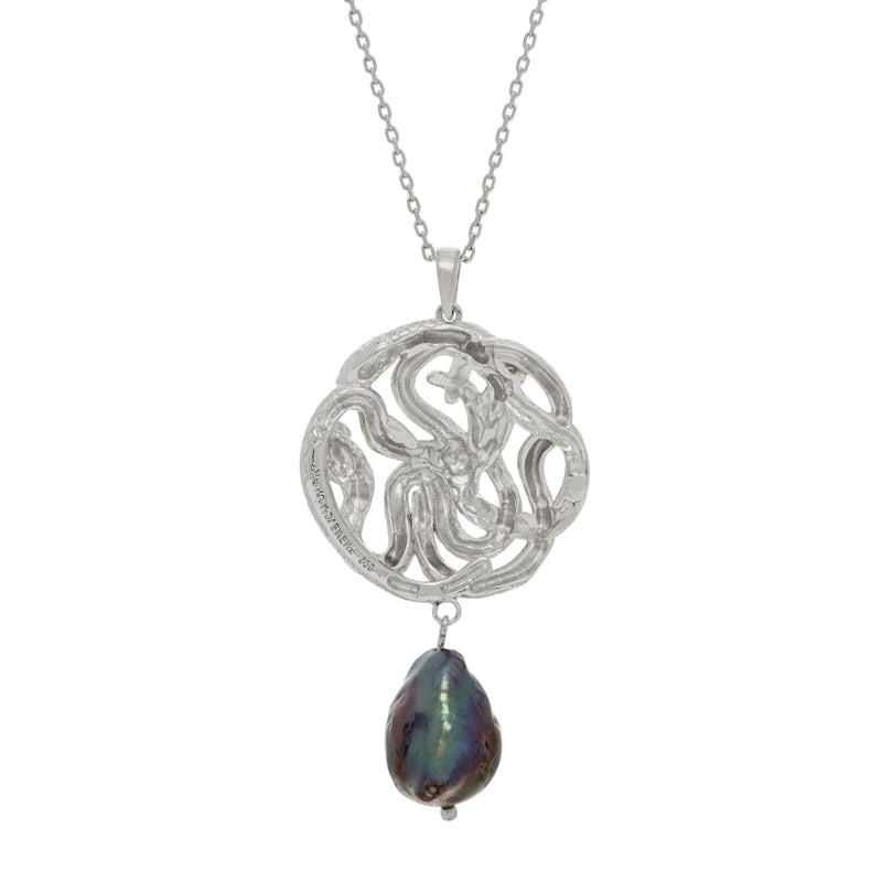 Silver necklace with a serpent pendant and a black pearl on a white background