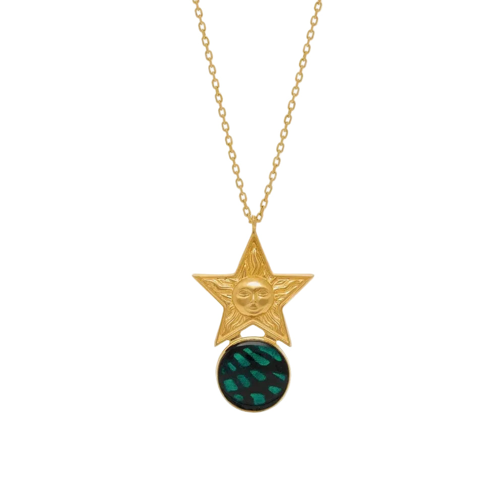 Gold necklace with star pendant and green gemstone on a white background