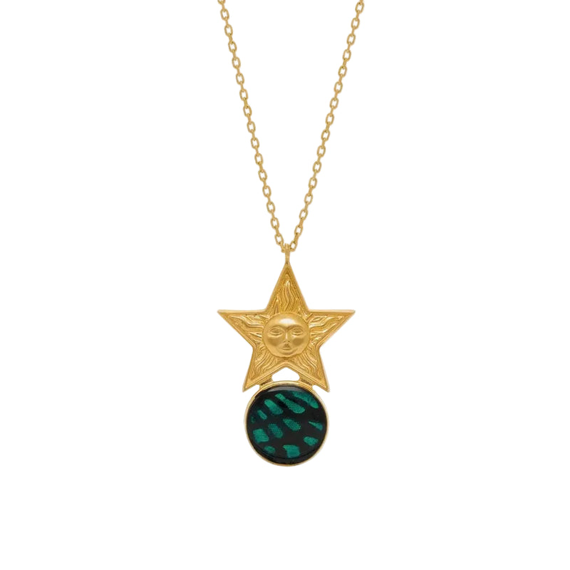 Gold necklace with star pendant and green gemstone on a white background