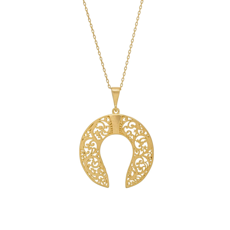 Gold necklace with a intricate pendant on a white background