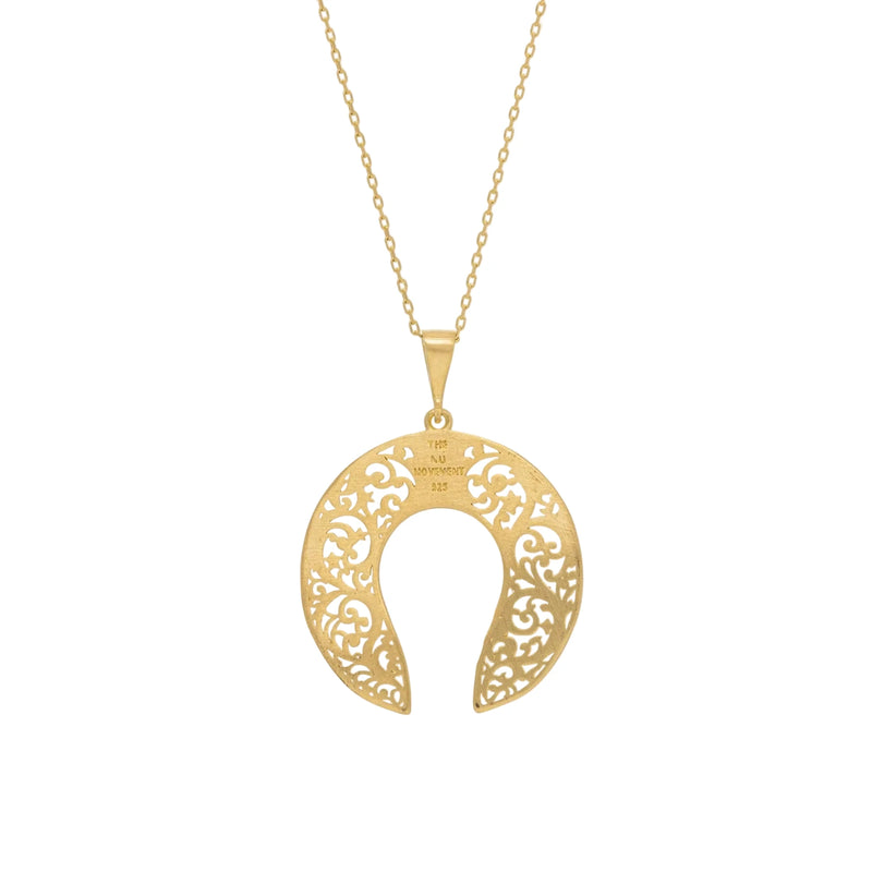 Gold necklace with a decorative pendant on a white background