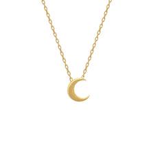 Gold necklace with a crescent moon pendant on a white background