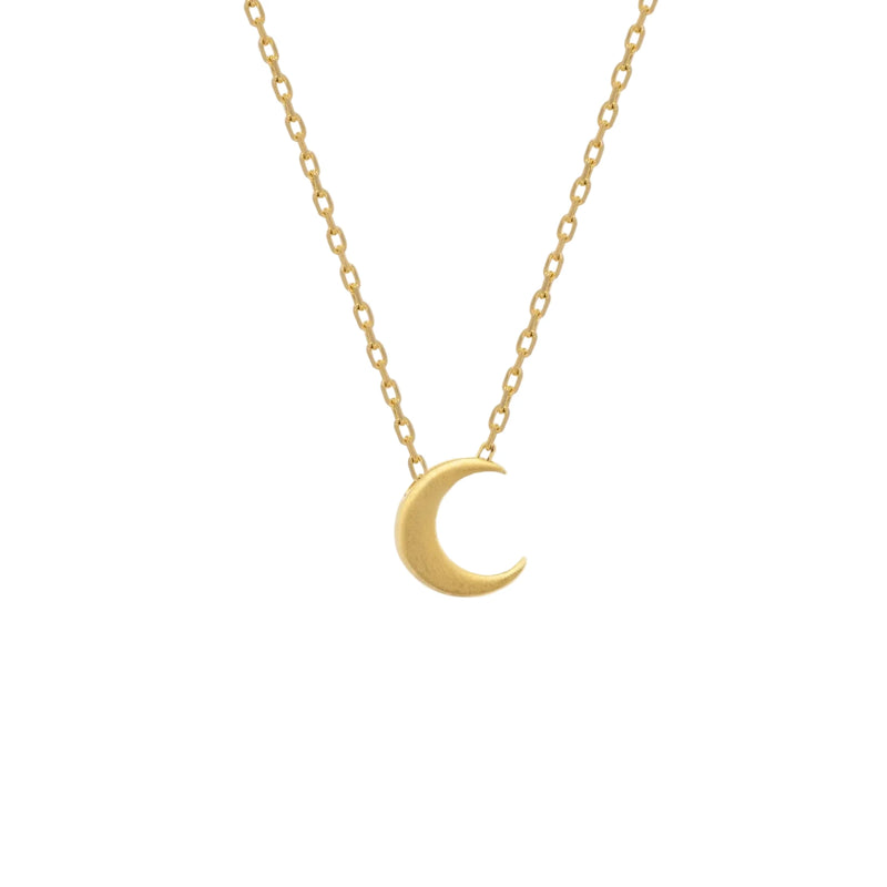 Gold necklace with a crescent moon pendant on a white background