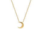Gold crescent moon necklace on a white background