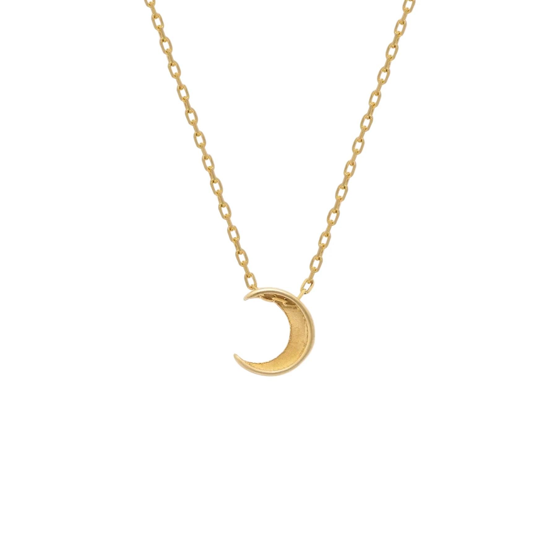 Gold crescent moon necklace on a white background