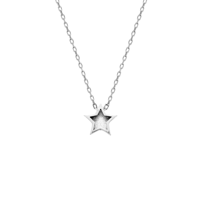 Silver star necklace on a white background