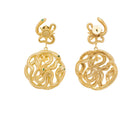 gold story earring with serpent light sun and star