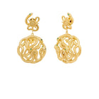 gold story earring with serpent light sun and star