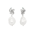 Pair of pearl earrings with silver snake designs on a white background