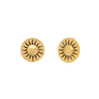 Gold sun-shaped earrings on a white background