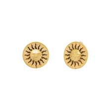 Gold sun-shaped earrings on a white background