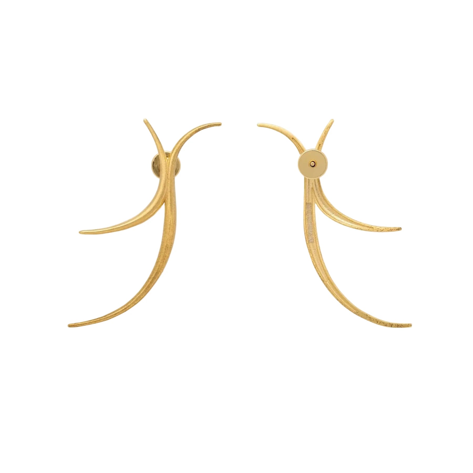 Gold earrings on a white background