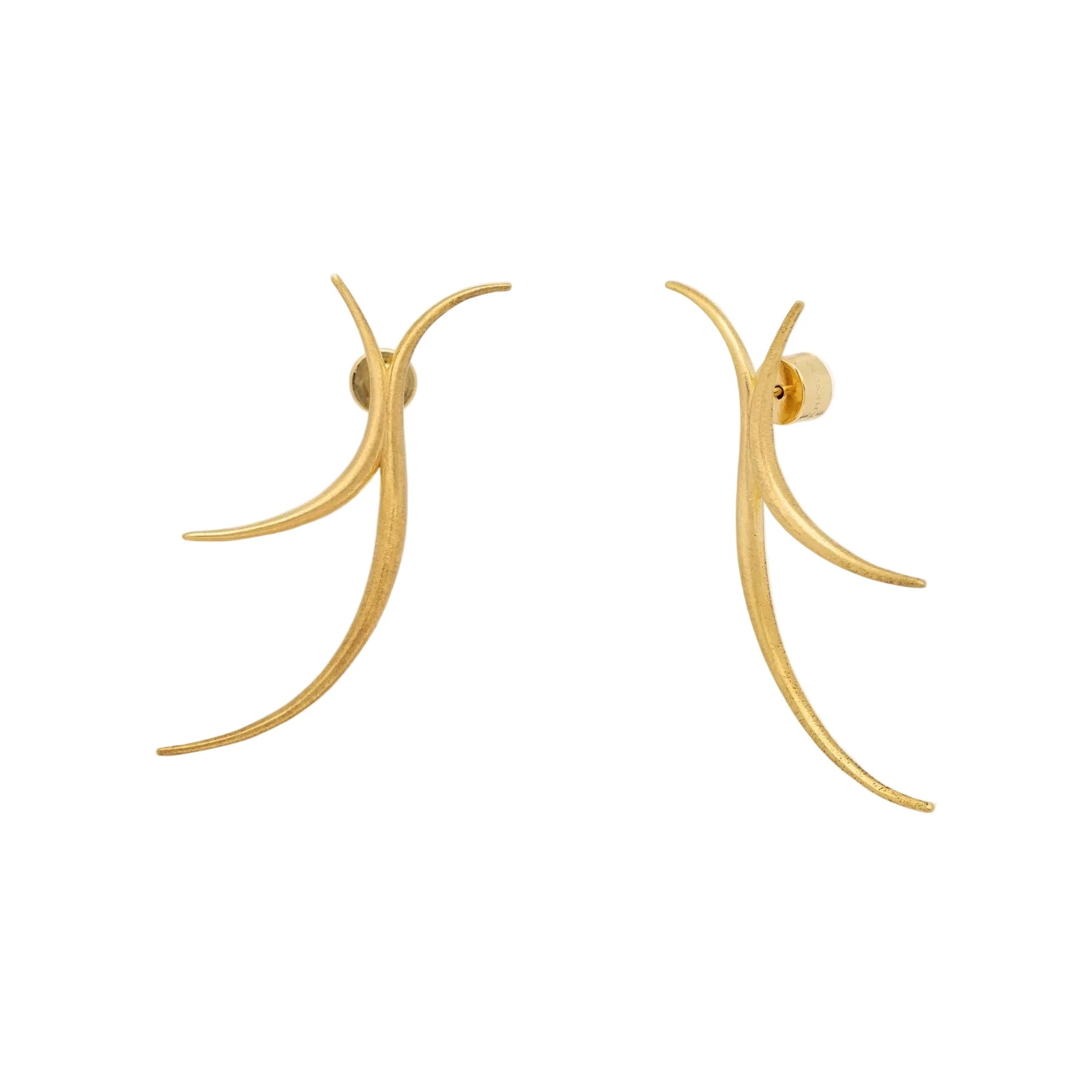 Gold earrings on a white background