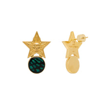 Gold star-shaped earrings with a green gemstone on a white background